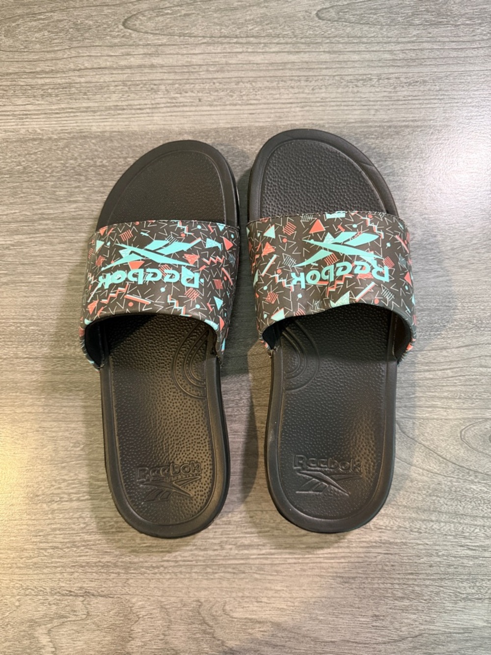 Reebok Black Slides with Turquoise Logo and Multicolor Geometric Strap